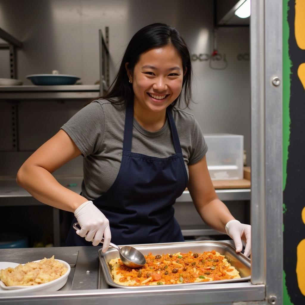 Annie Nguyen, the founder of Annie Up Food Truck, smiles as she prepares food in her truck.