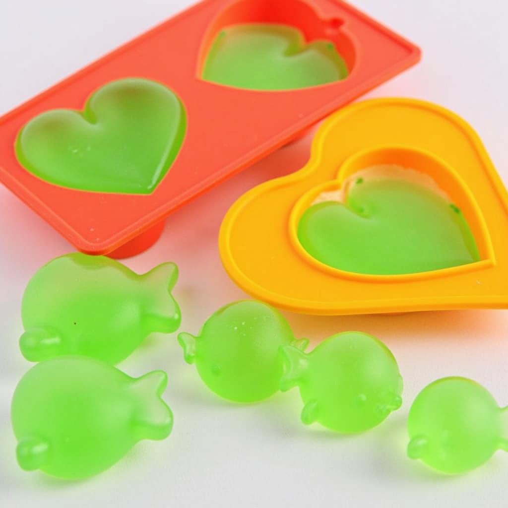 Heart and fish-shaped cat food jello set in a silicon mold