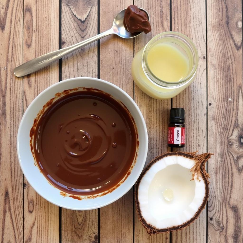 Ingredients for a DIY cacao butter hair mask arranged on a table