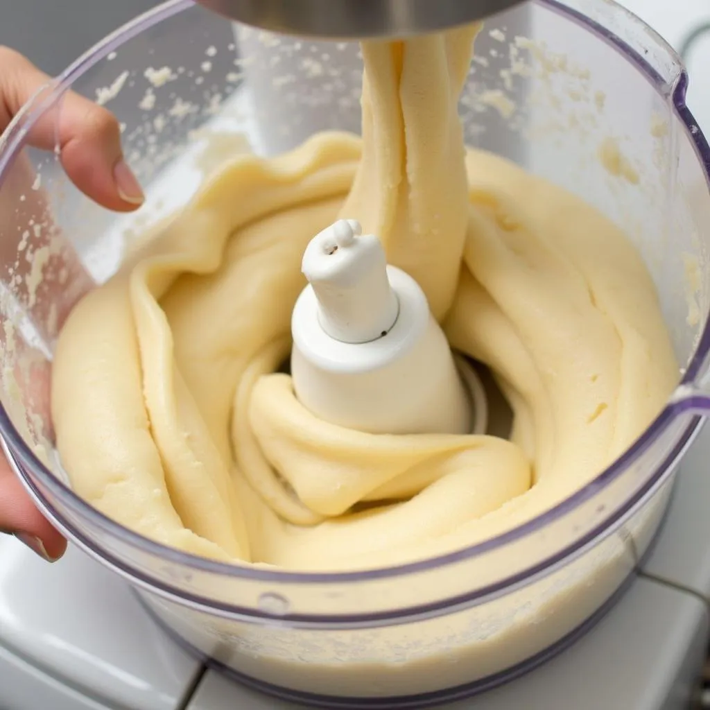 Food processor kneading dough for rolls