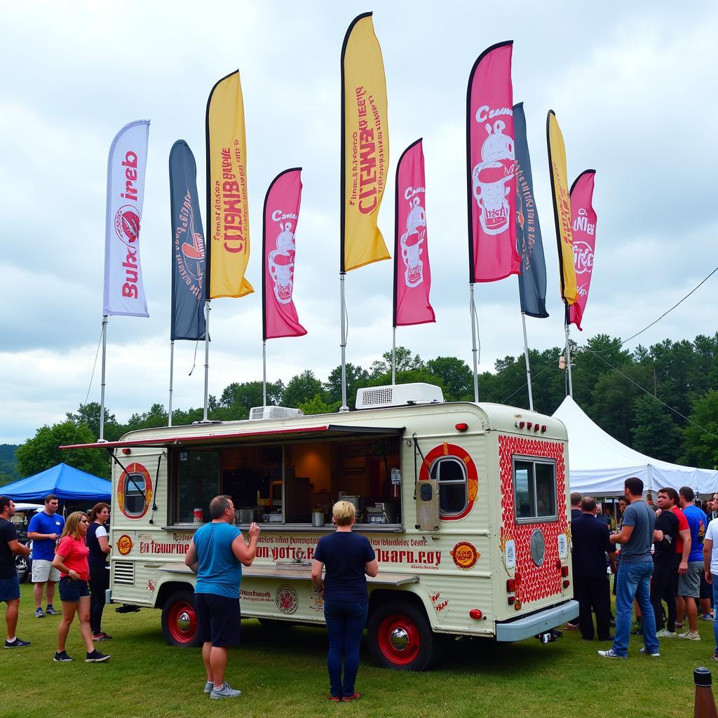  A food truck strategically placed at an outdoor event with multiple feather flags surrounding it, creating a vibrant and inviting atmosphere.