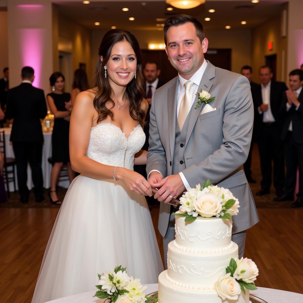 A couple cutting into a beautifully decorated cake during their Haitian wedding reception, symbolizing unity and the sweetness of their new life together.