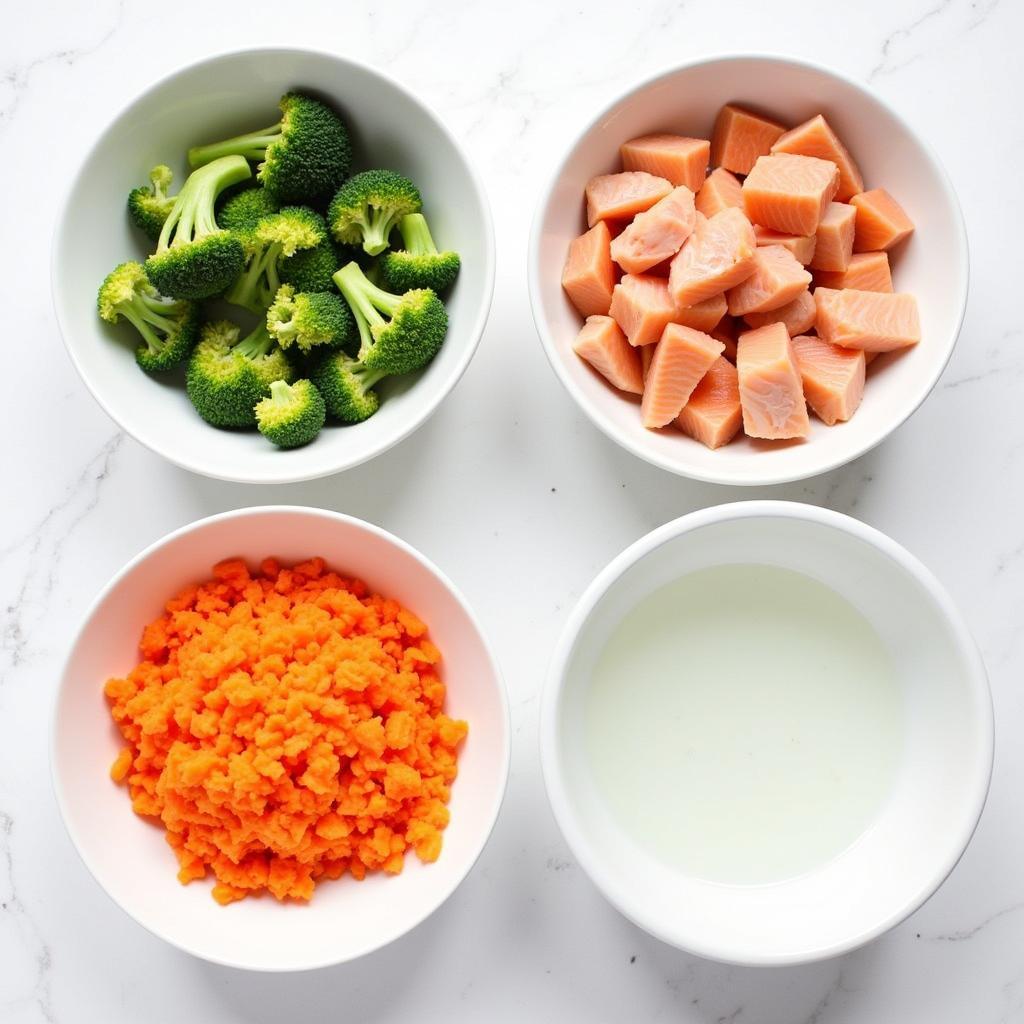 A variety of fresh ingredients suitable for a homemade cat food recipe, including cooked chicken, salmon, carrots, and broccoli.