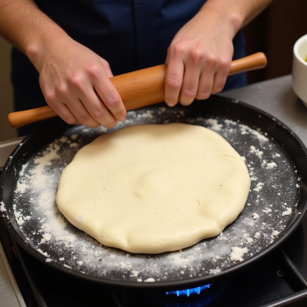 A flat tava, used for cooking rotis, parathas, and dosas.