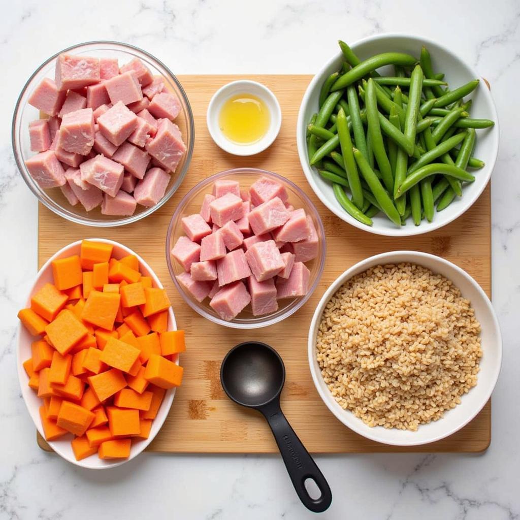 A variety of fresh ingredients laid out for preparing homemade pork dog food.