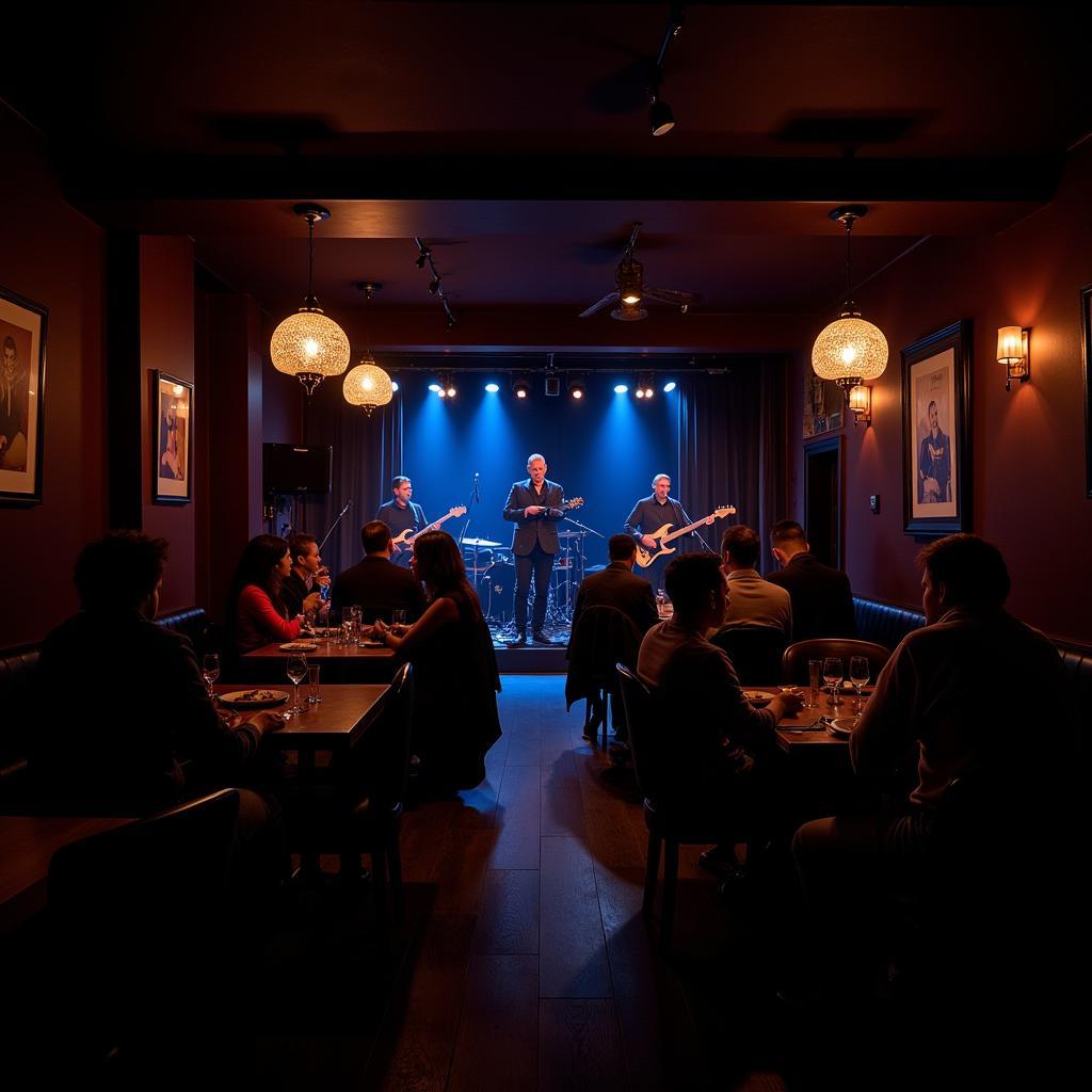 A dimly lit jazz club with a stage and people enjoying food and drinks.