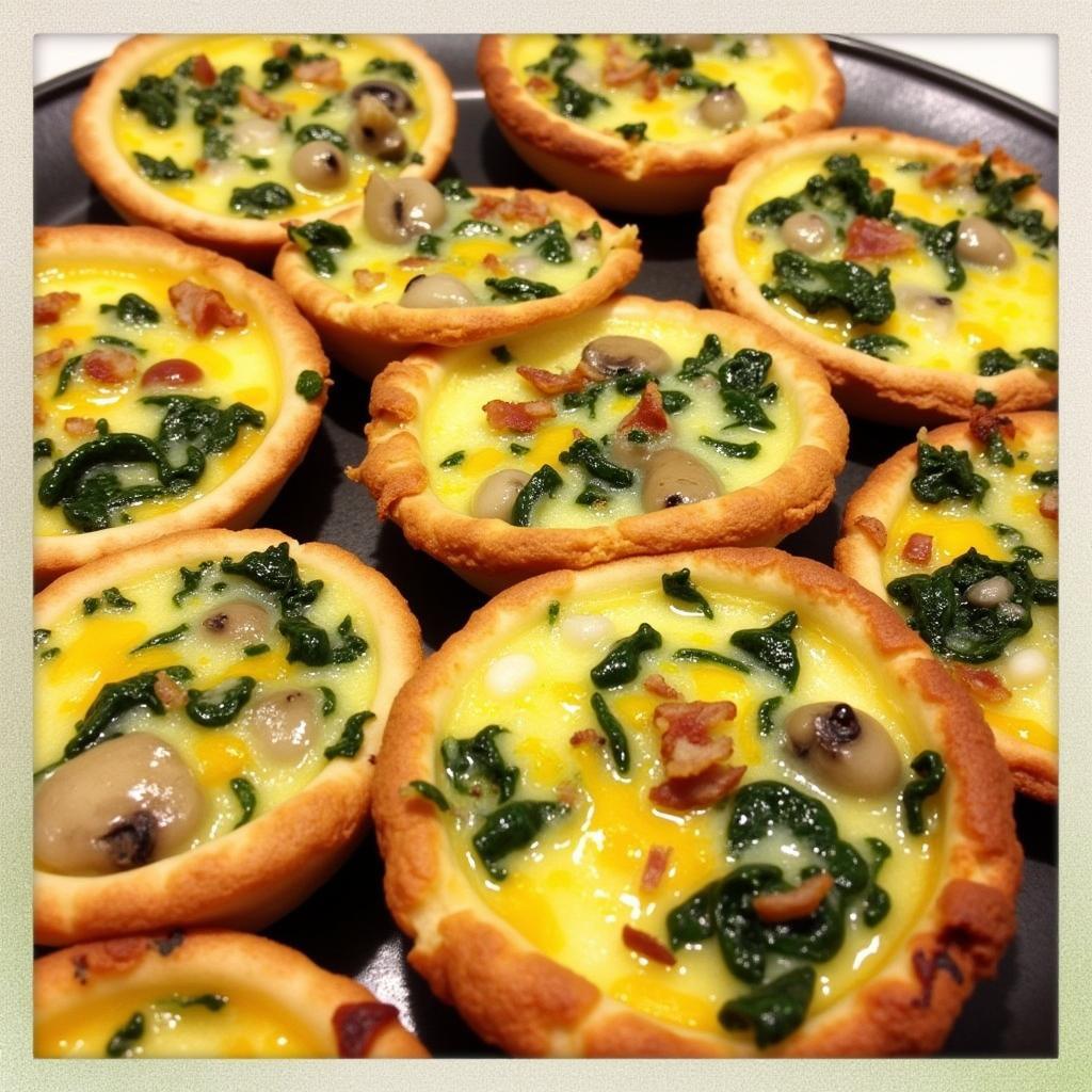 Assorted mini quiches on a platter