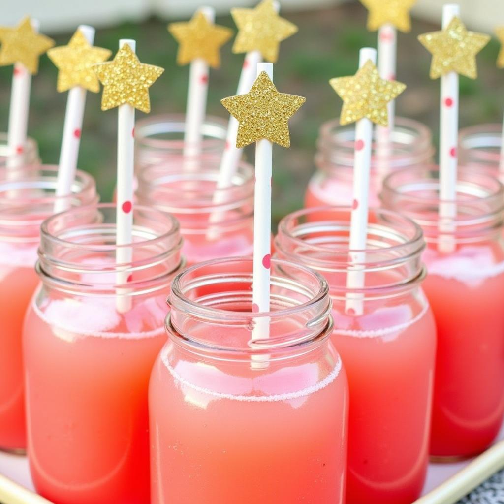 Pink Lemonade in Mason Jars with Straws