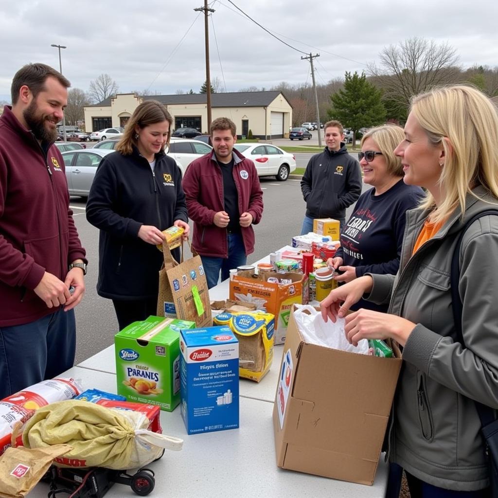 Community members donating food at a drive for Point Church Food Pantry