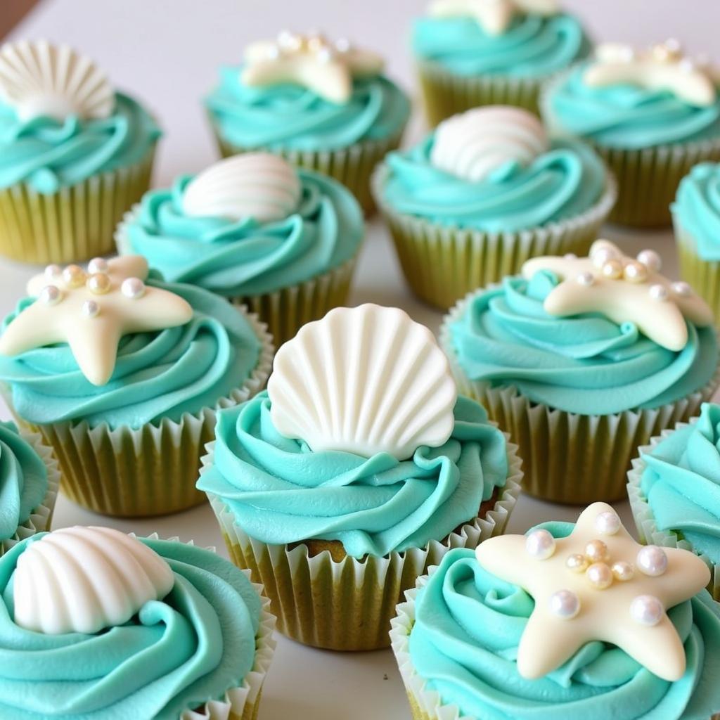 Teal Frosted Cupcakes Decorated with Ocean Motifs