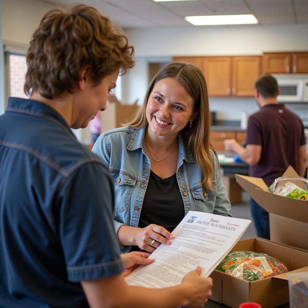 A food bank staff member provides guidance to a community member