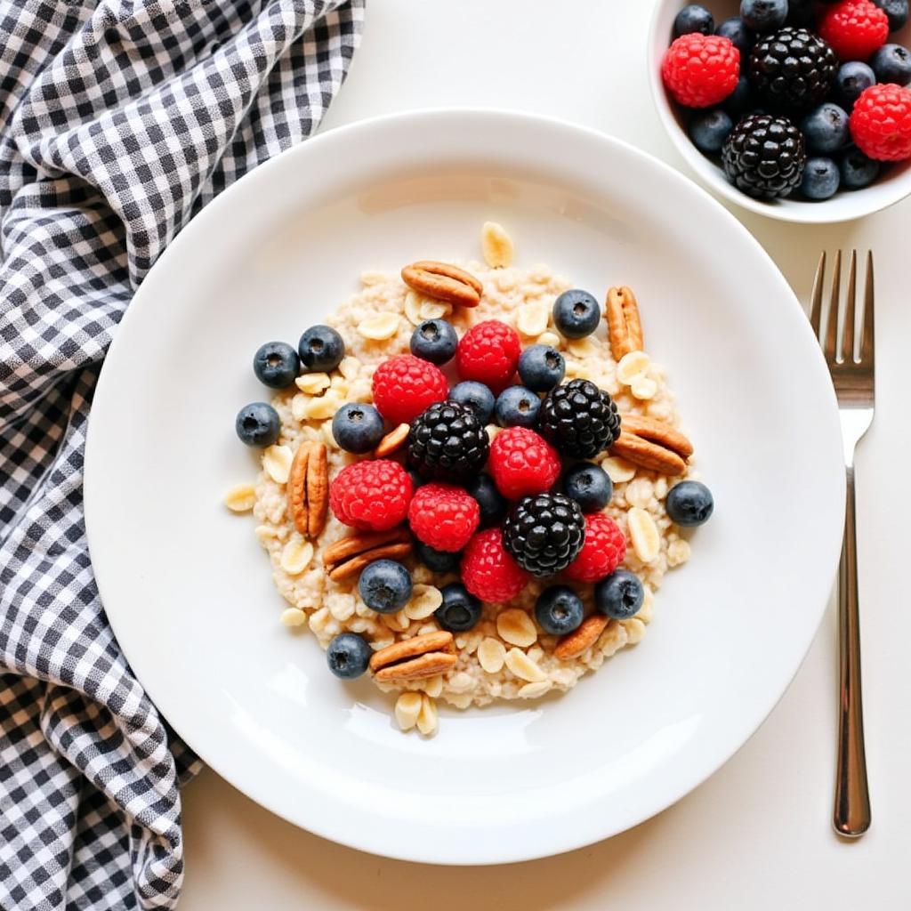 A woman enjoying a healthy breakfast of oatmeal with berries and nuts.