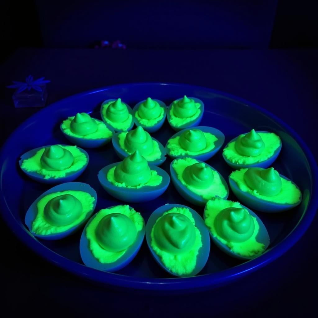 Glowing deviled eggs platter with neon green filling.