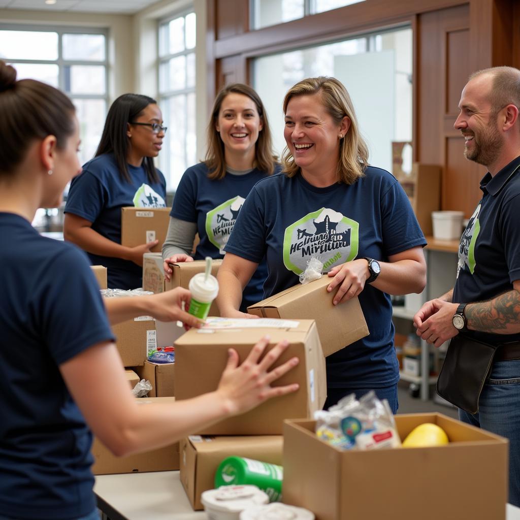 Volunteers distributing food packages at Helping Hand Ministry