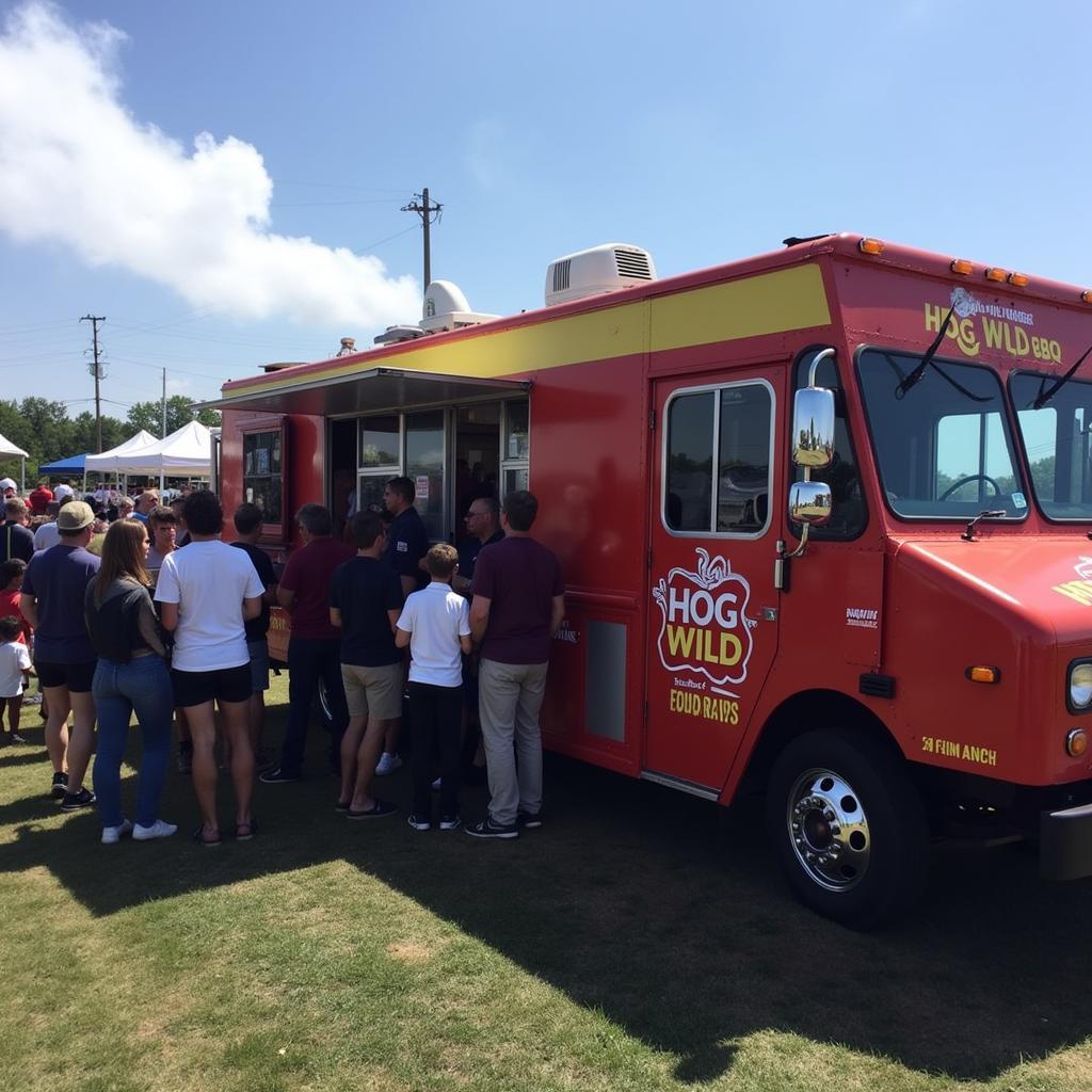 Hog Wild BBQ food truck serving a crowd of happy customers