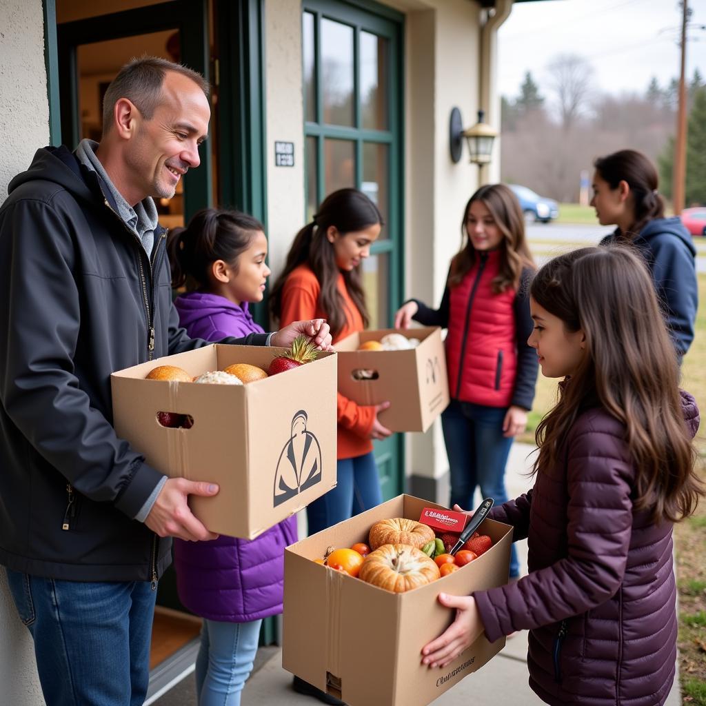 Families Receiving Thanksgiving Food Boxes at a House of Charity