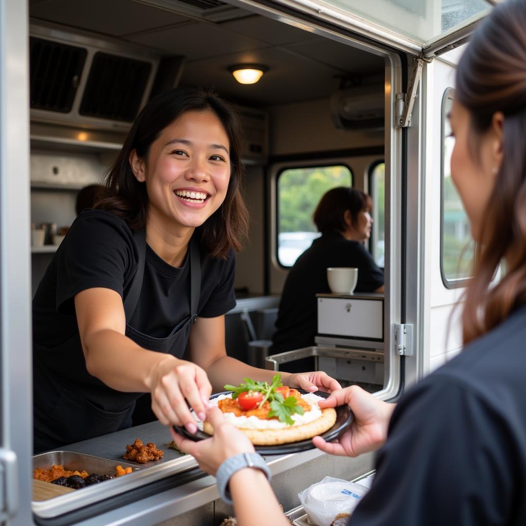 JK Food Truck Owner Jamie Kim Serving Customers