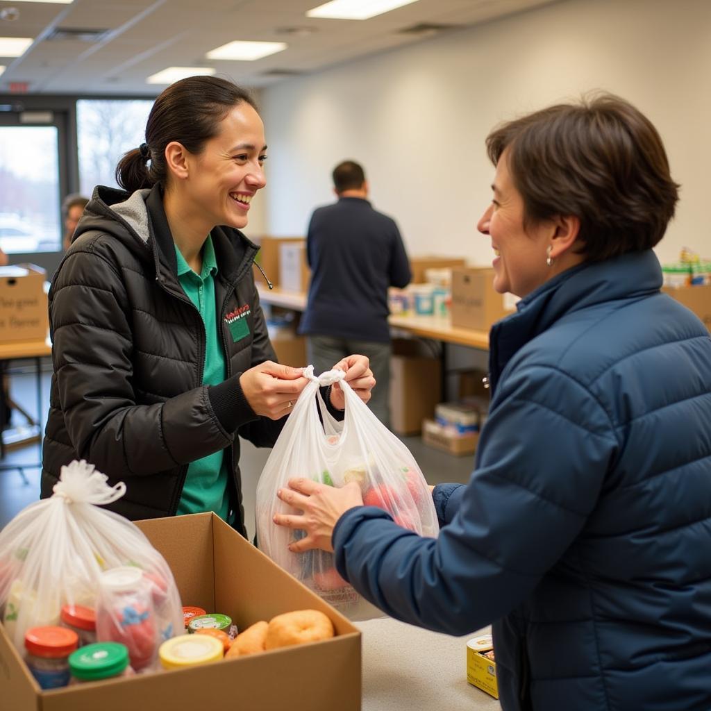 Client receiving food assistance at a Peabody food pantry