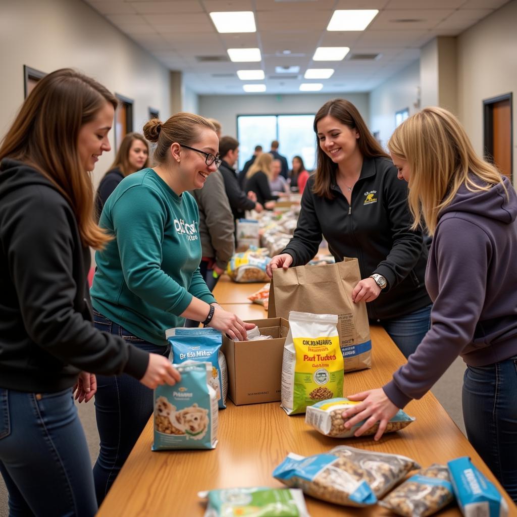 Volunteers distributing pet food at a local pet food bank