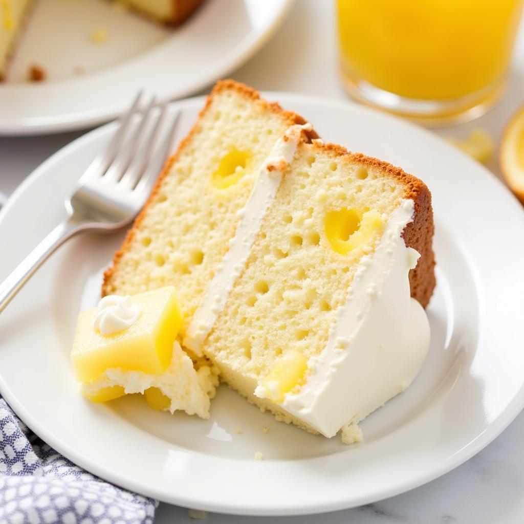 A slice of pineapple angel food cake on a plate.