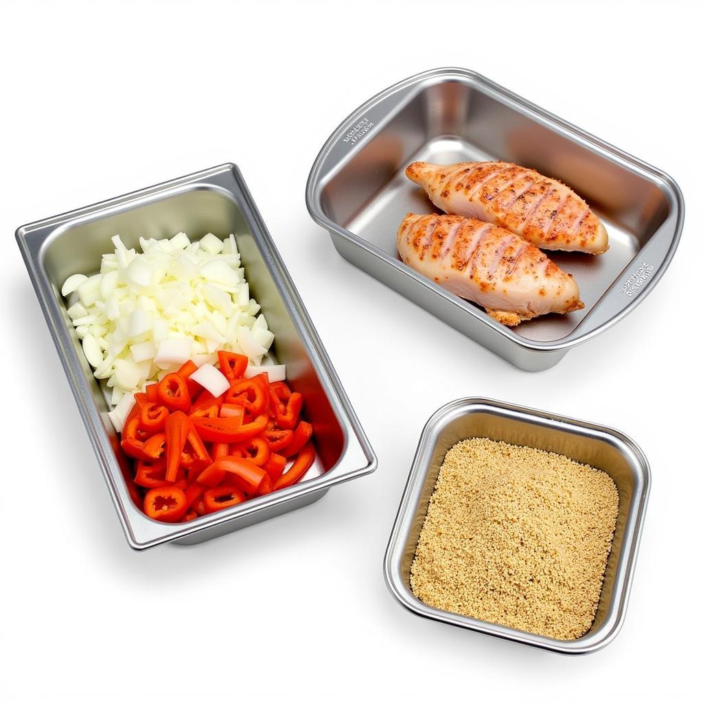 Stainless steel food prep pans filled with prepped ingredients