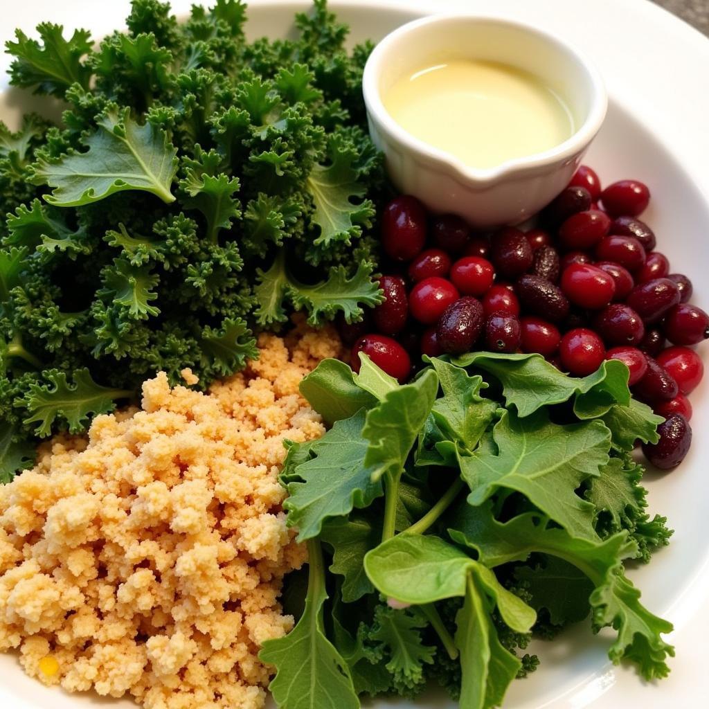 Close-up of fresh kale, cranberries, breadcrumbs, and dressing ingredients.