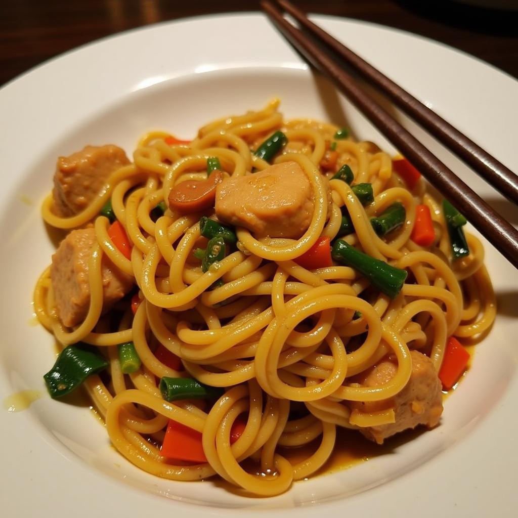 A plate of delicious hand-pulled noodles with vegetables and meat at a Woodlawn Chinese restaurant