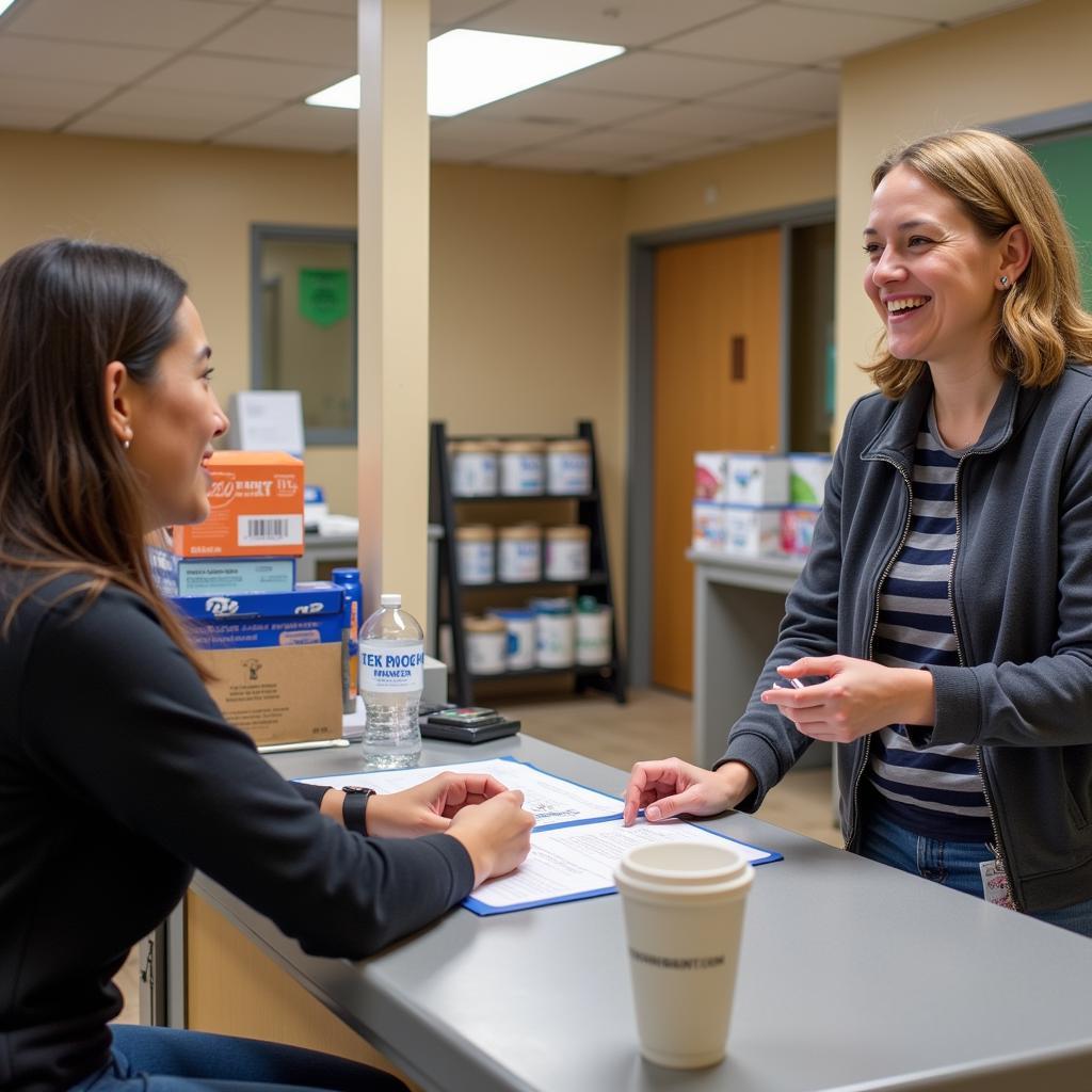 A volunteer assisting a client at a Deltona food pantry intake desk