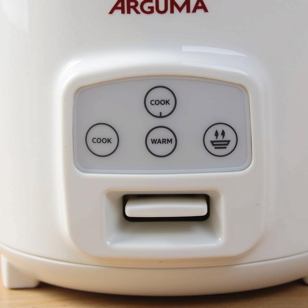 Close-up view of the control panel settings on an Aroma rice cooker