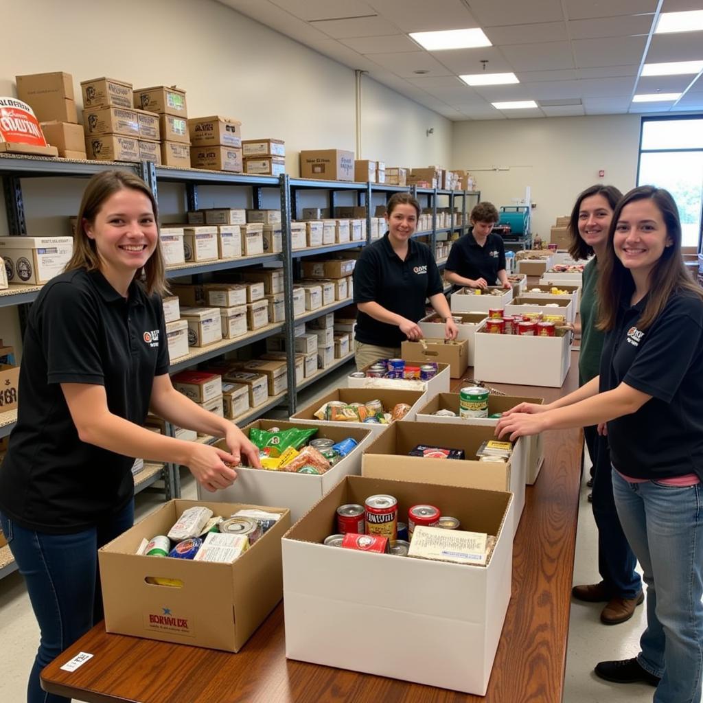 Volunteers at a food pantry in Lancaster, Ohio sorting and packing food donations.