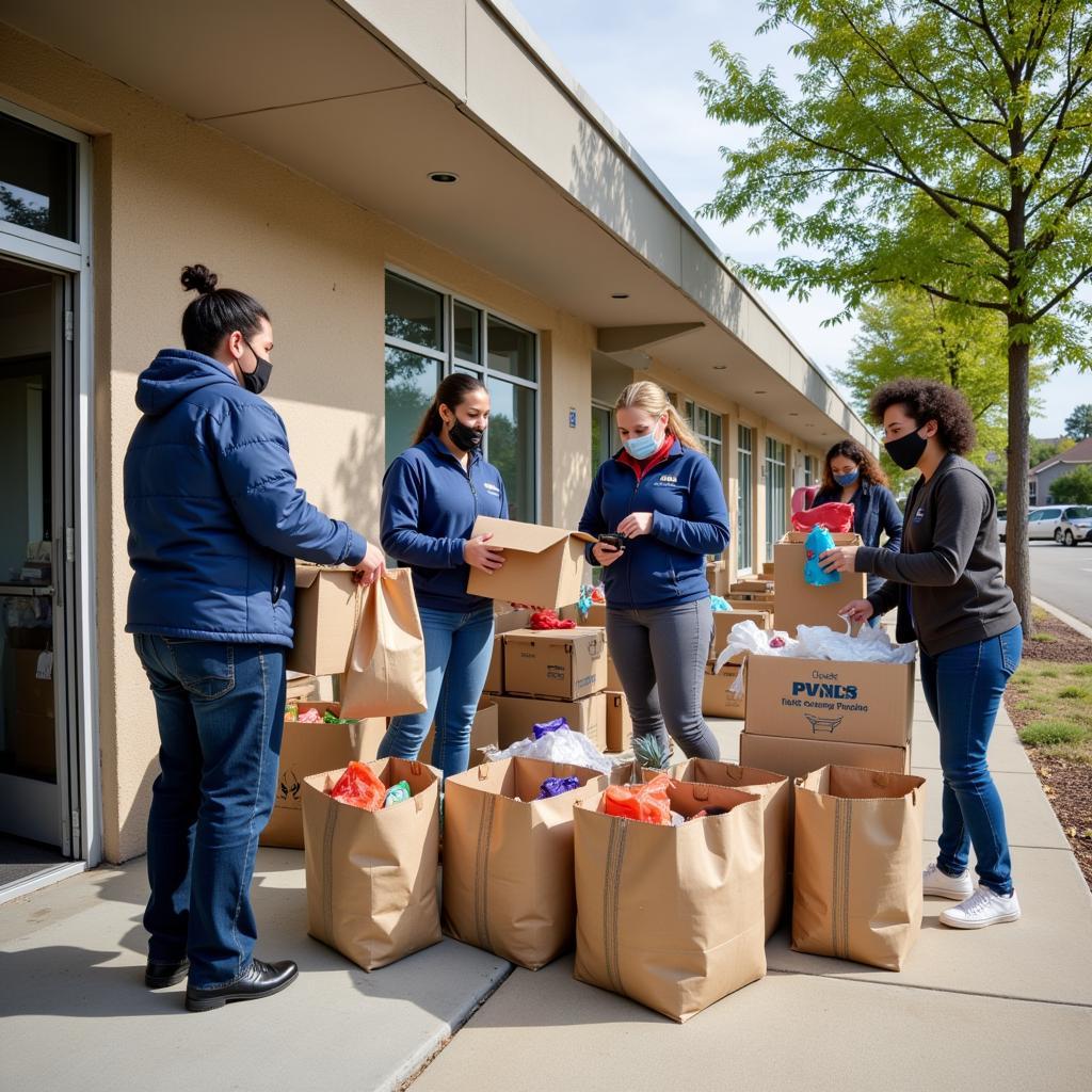 Community members donating food and clothing at Pven