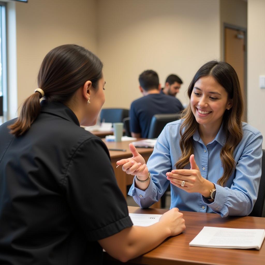 A client speaks with a staff member at the Salvation Army Food Bank intake desk.